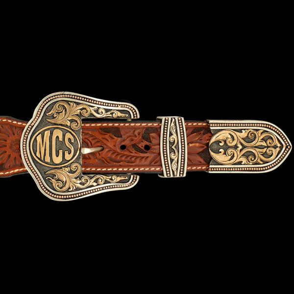The Ruby Three Piece Buckle Set is one of our best sellers! Featuring a beaded border with intrincate bronze scrollwork and customizable initials or ranch brand. Pair it with a discount belt and keychain!